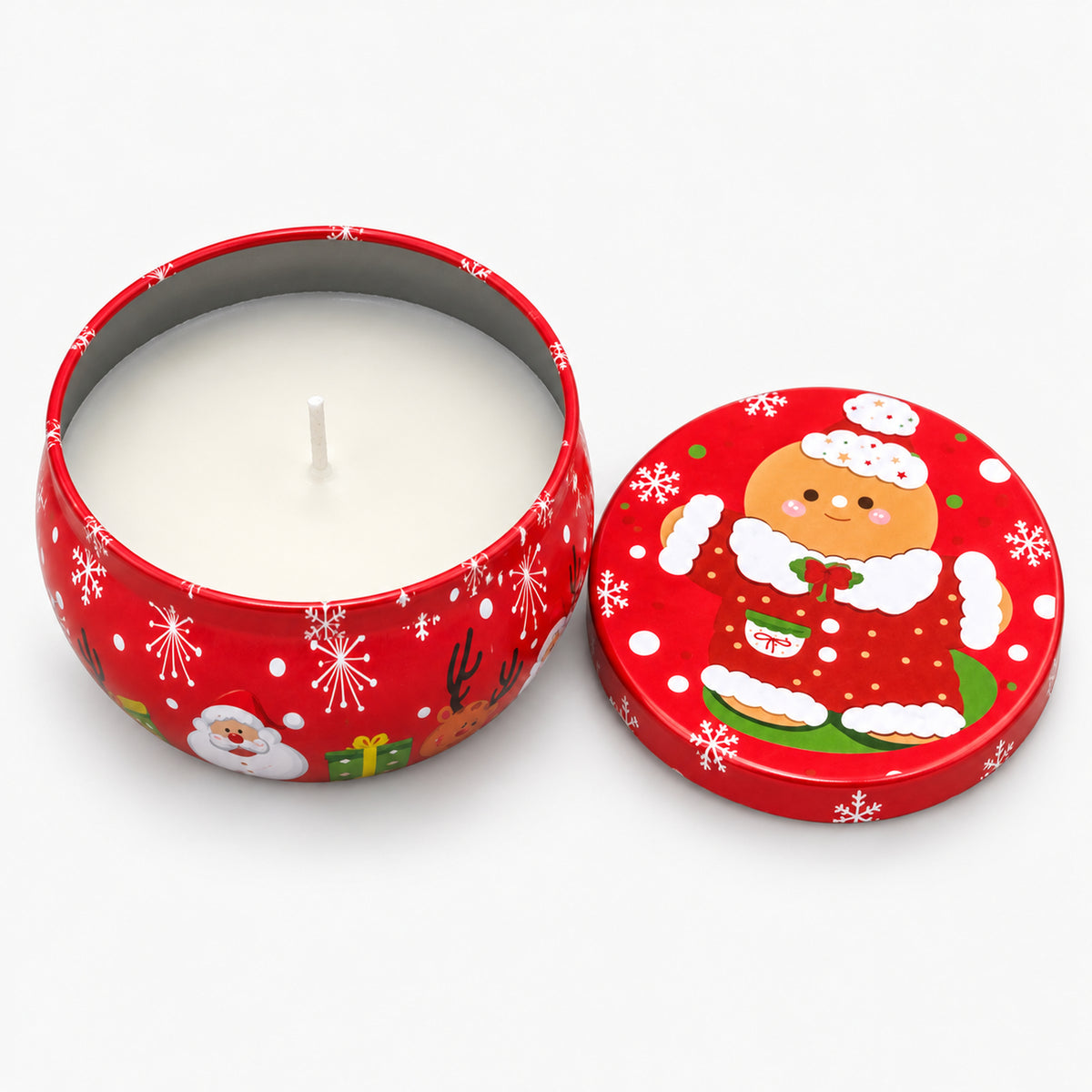 Red Christmas candle tin with gingerbread, open with a white candle inside