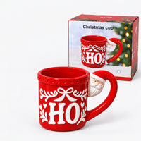 Red HO Christmas mug next to its Christmas cup gift box