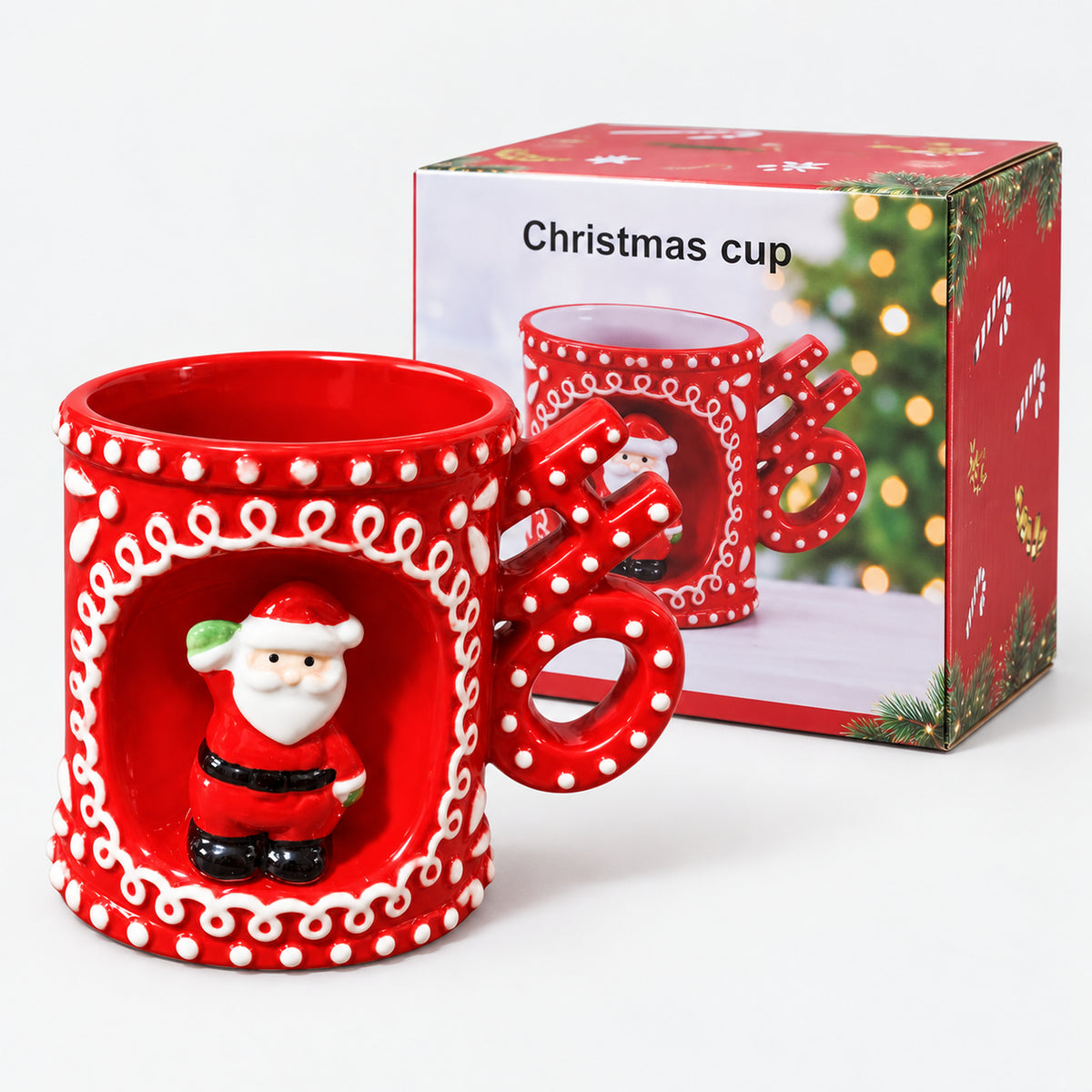 Standing Santa mug with HO handle next to its Christmas cup gift box