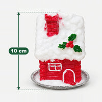 Red house Christmas candle measuring 10 cm high