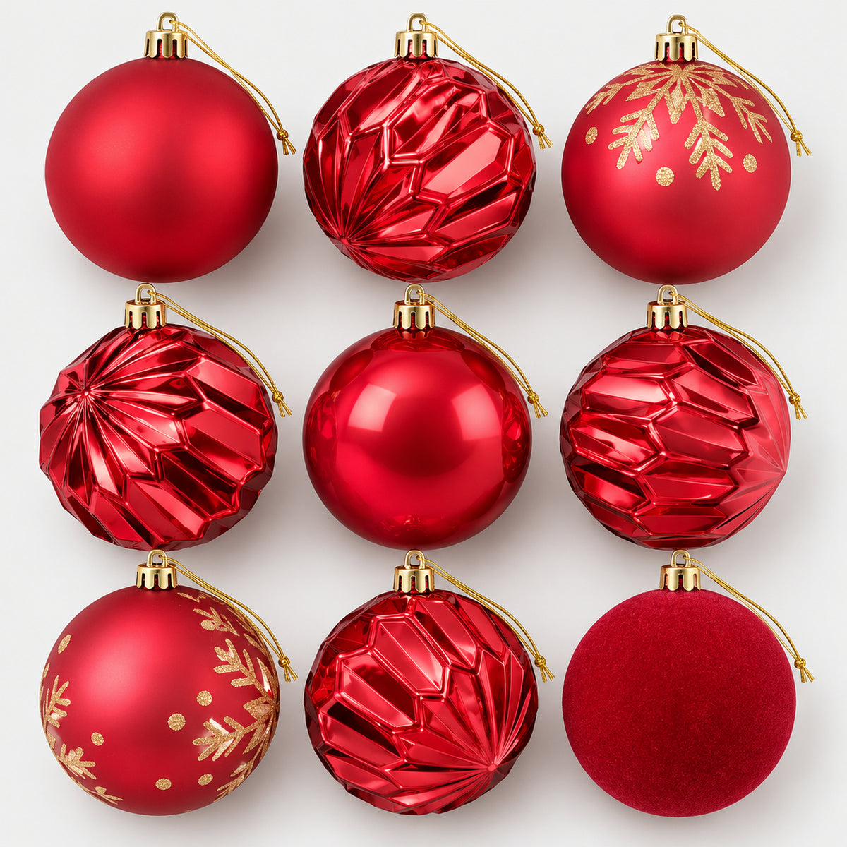 9 red Christmas balls with gold caps and strings in a mix of finishes