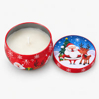 Red Christmas candle tin with Santa and a reindeer, open with a white candle inside