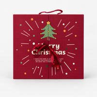 Red Christmas tree advent calendar gift box with a ribbon and handle