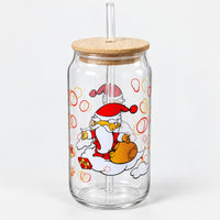 Christmas glass can cup with Santa carrying his gift sack, a lid and a straw