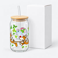 Santa and reindeer glass cup next to its white box