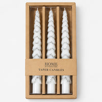 Silver Christmas tree taper candles in a kraft window box