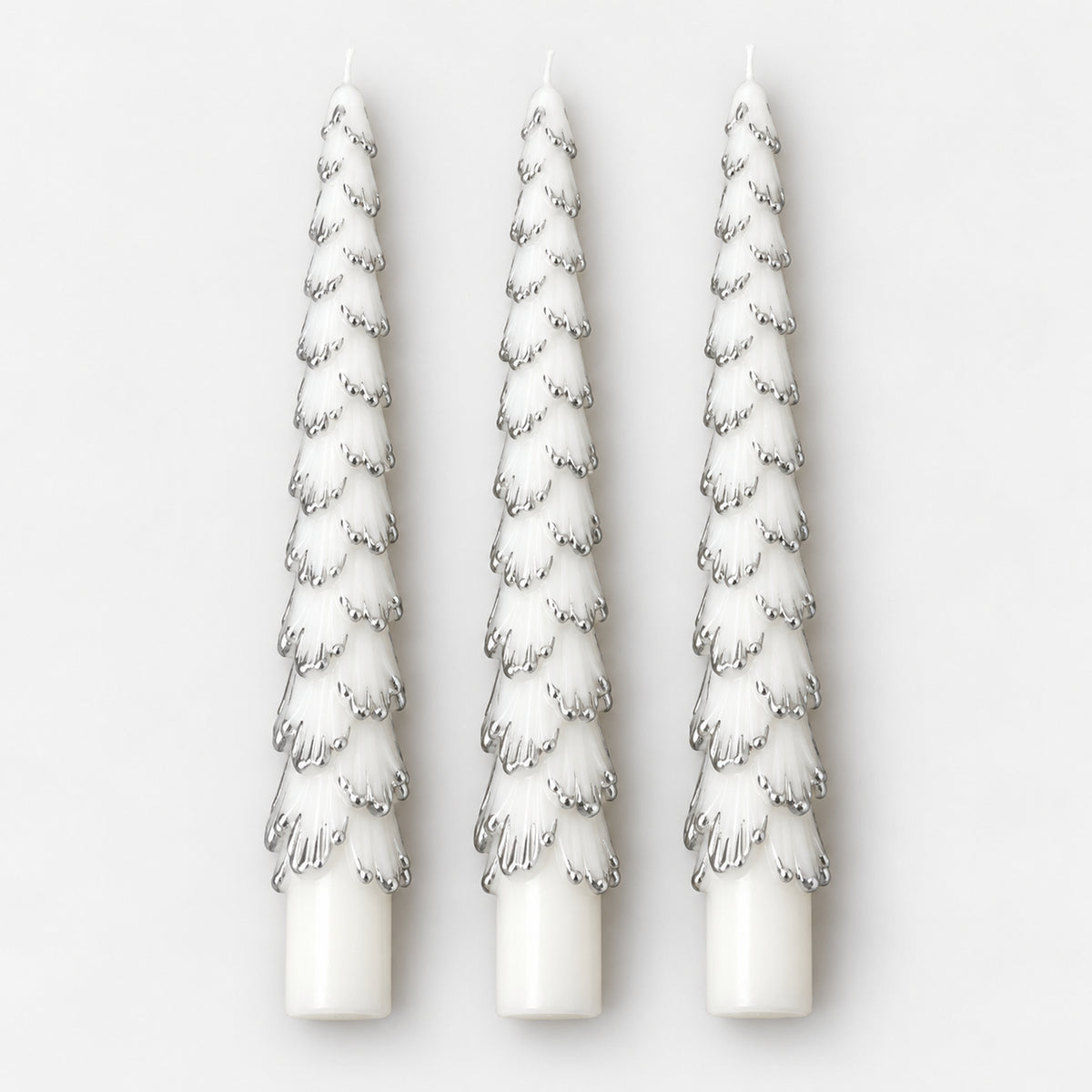 3 white Christmas tree taper candles with silver tips