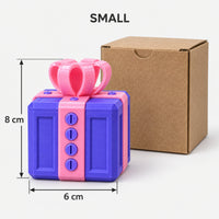 Small purple & pink prank gift box next to its kraft box