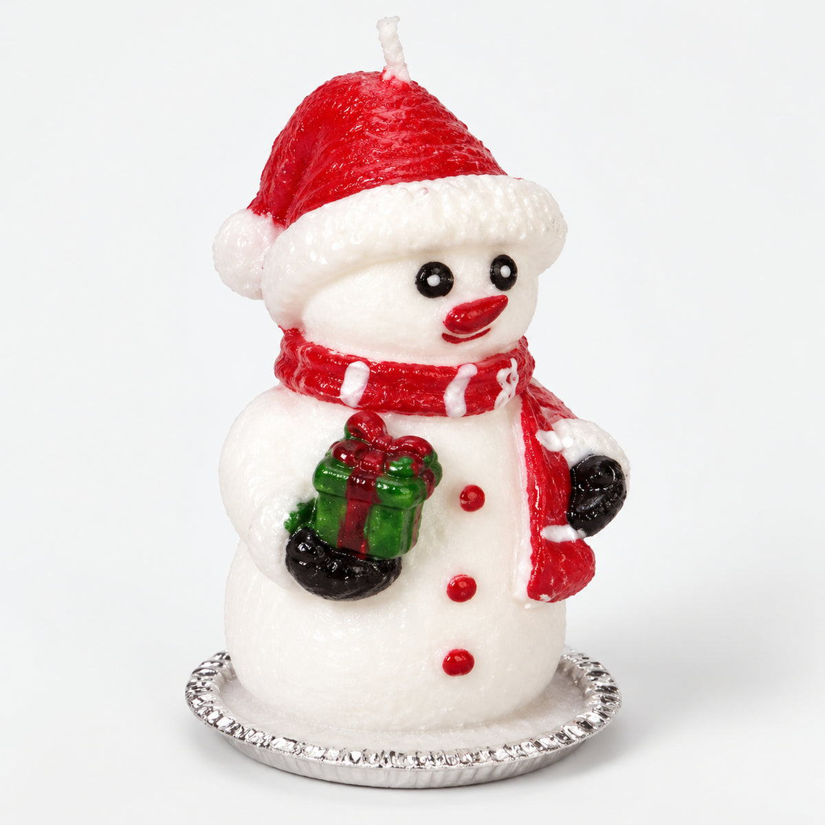 Snowman Christmas candle with a red hat and scarf on a silver tray