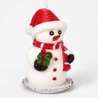 Snowman Christmas candle with a red hat and scarf on a silver tray