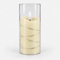 White 12.5cm LED candle in a clear cup with fairy lights, switched off