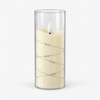 White 15cm LED candle in a clear cup with fairy lights, switched off