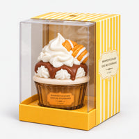 Whipped cream cupcake perfume in its yellow striped gift box